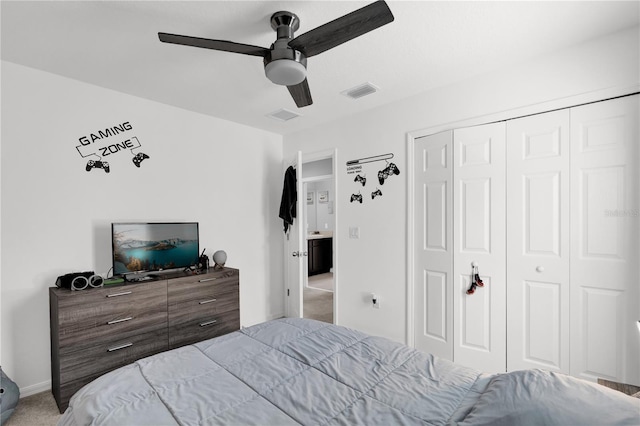 carpeted bedroom with a closet and ceiling fan