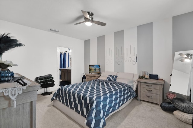 bedroom with ceiling fan and light colored carpet