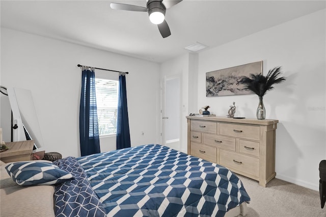 bedroom featuring light carpet and ceiling fan