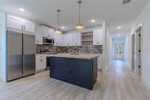 kitchen featuring open shelves, appliances with stainless steel finishes, light countertops, and white cabinets