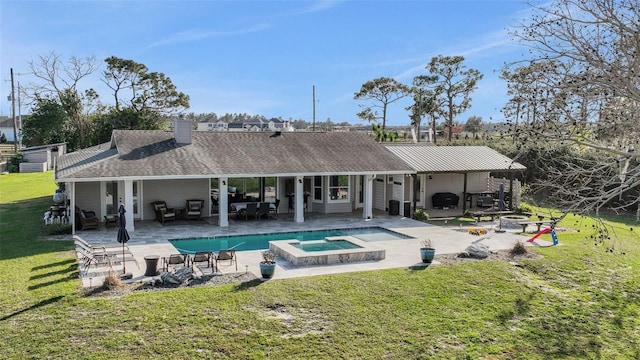 back of house featuring a swimming pool with hot tub, a lawn, and a patio area