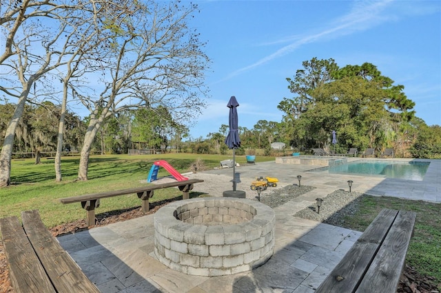 exterior space featuring an outdoor fire pit