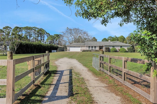 view of front facade with a garage and a front yard