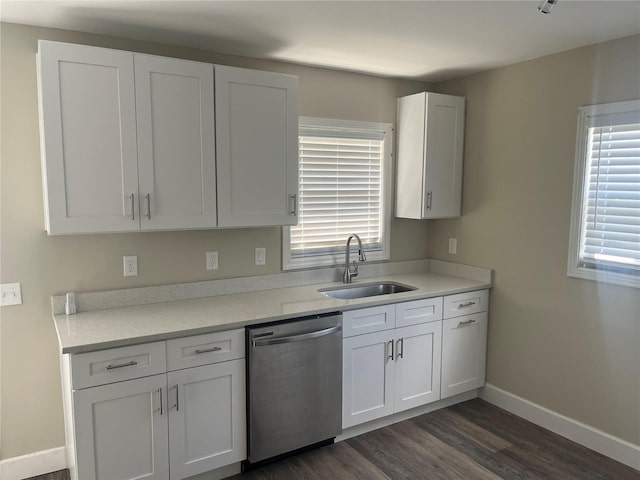 kitchen with white cabinetry, sink, a wealth of natural light, and stainless steel dishwasher