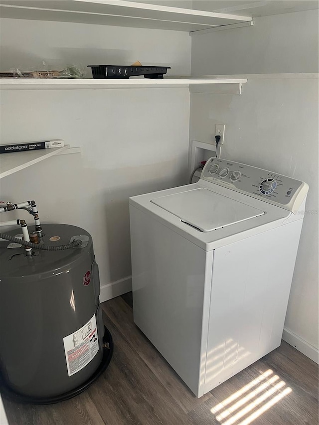 washroom featuring dark wood-type flooring, washer / dryer, and electric water heater