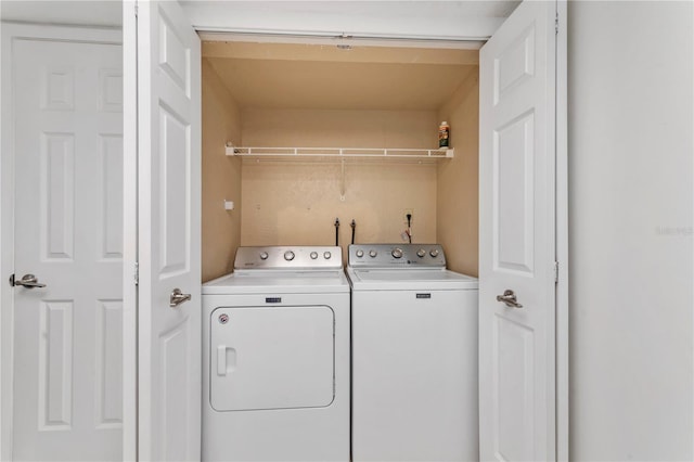 laundry room with washing machine and dryer