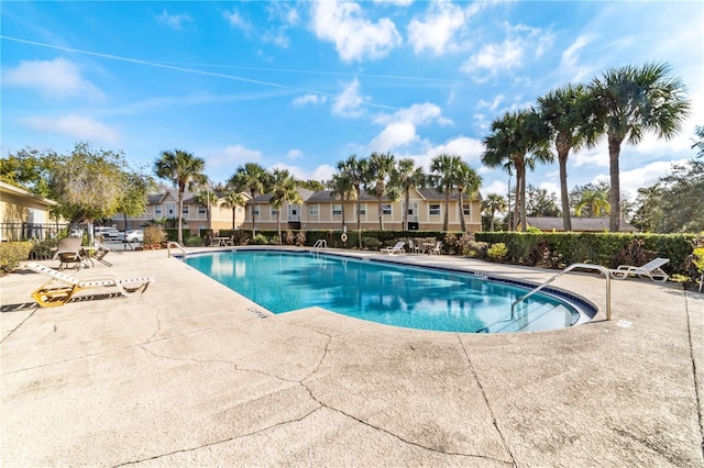 view of swimming pool with a patio