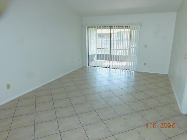 empty room featuring light tile patterned floors