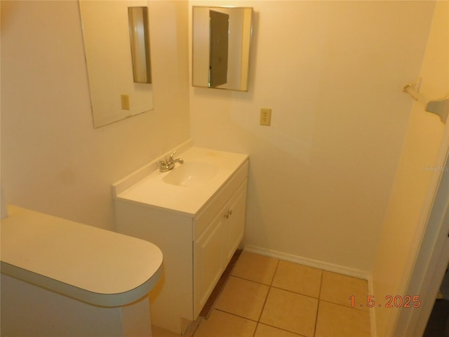 bathroom with vanity and tile patterned flooring