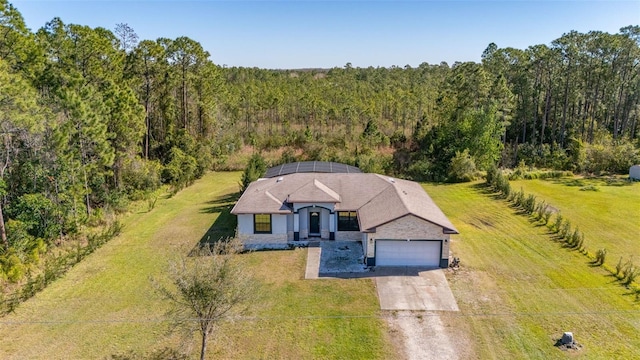 drone / aerial view with a forest view