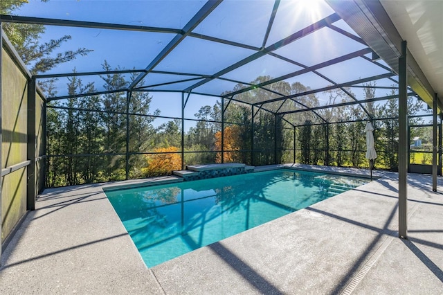 outdoor pool featuring a lanai and a patio area