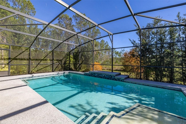 outdoor pool with a lanai and a patio