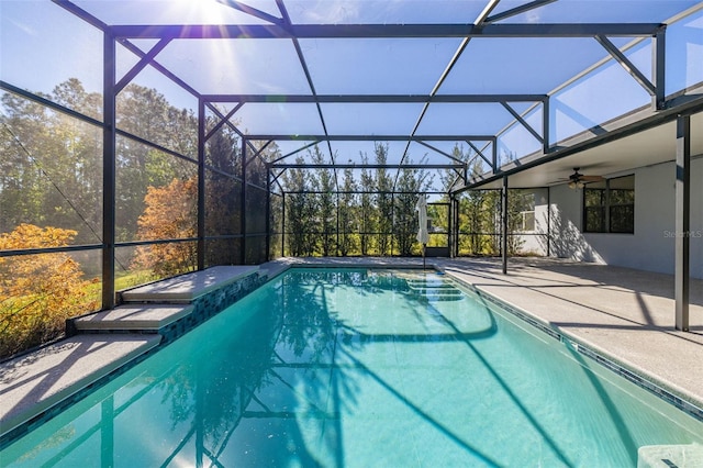 outdoor pool featuring a patio, a lanai, and a ceiling fan