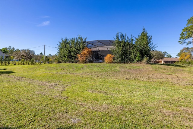 view of yard with a lanai