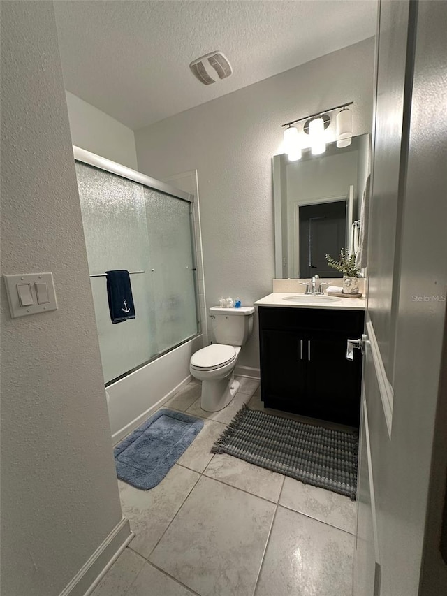 full bathroom with vanity, toilet, a textured ceiling, and shower / bath combination with glass door