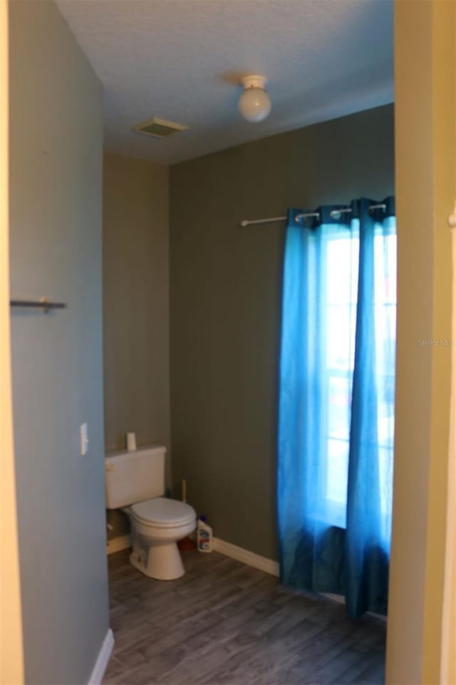 350 Chelmsford Ct, Kissimmee, FL 34758 - bathroom with toilet and wood finished floors