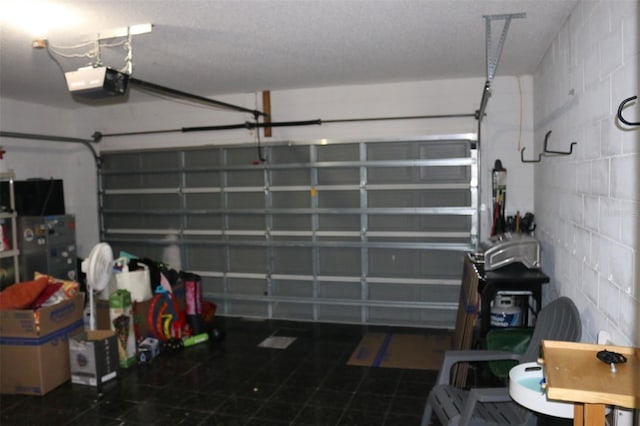 350 Chelmsford Ct, Kissimmee, FL 34758 - garage featuring a garage door opener and concrete block wall