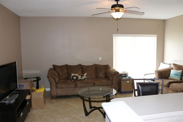 350 Chelmsford Ct, Kissimmee, FL 34758 - living area with a ceiling fan and light tile patterned flooring