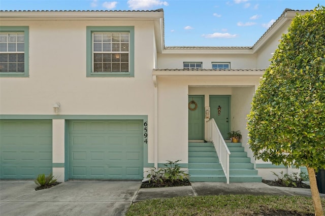 mediterranean / spanish-style house featuring a garage