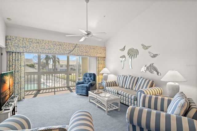 carpeted living room featuring lofted ceiling and ceiling fan