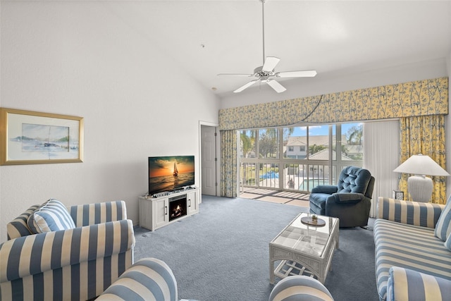 living room with ceiling fan, carpet flooring, and high vaulted ceiling