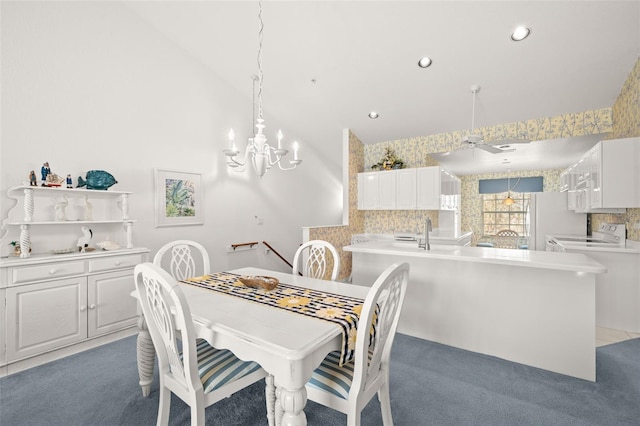 carpeted dining room with lofted ceiling, a notable chandelier, and washer / clothes dryer