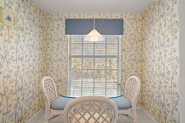 dining room featuring light tile patterned flooring and a healthy amount of sunlight