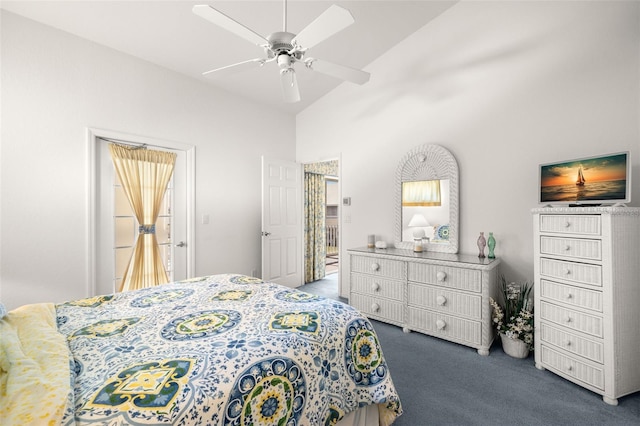 carpeted bedroom featuring ceiling fan and high vaulted ceiling