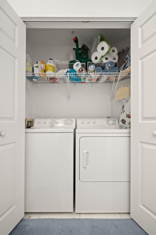 laundry area with separate washer and dryer