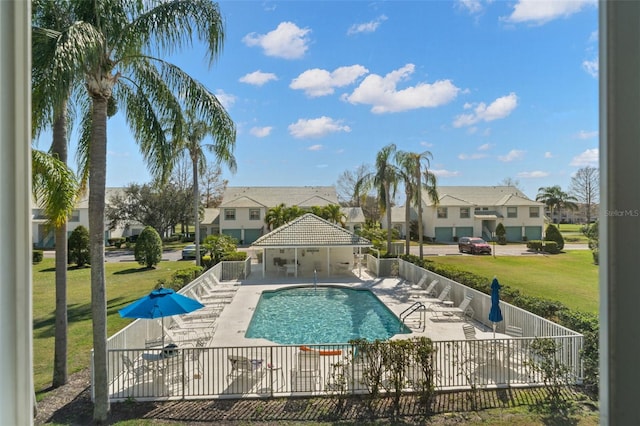 view of pool featuring a yard and a patio