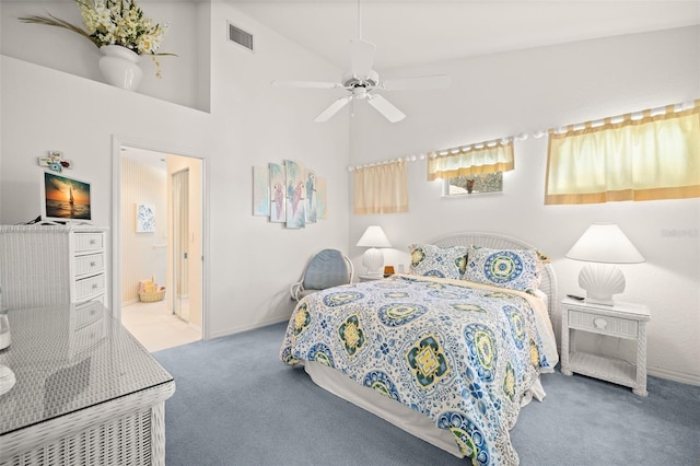 bedroom featuring high vaulted ceiling, ensuite bathroom, ceiling fan, and carpet flooring