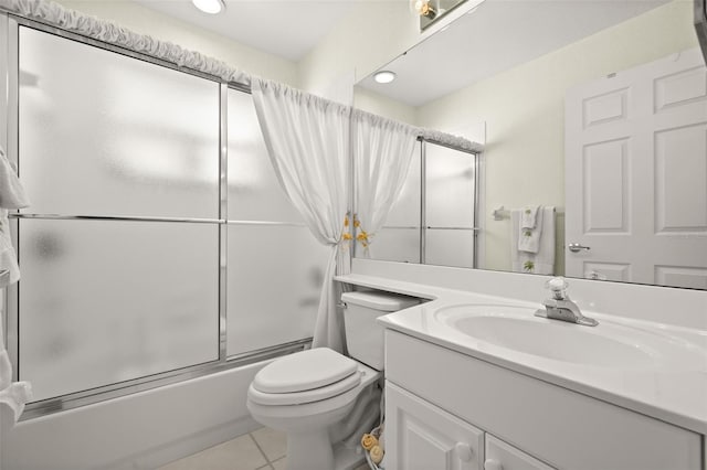 full bathroom with enclosed tub / shower combo, tile patterned floors, toilet, and vanity