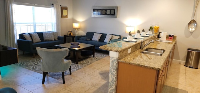 tiled living room featuring sink