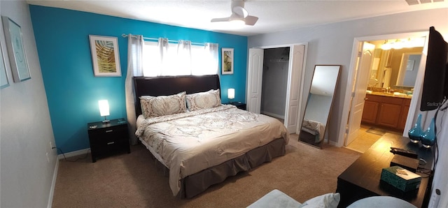 carpeted bedroom with ceiling fan and a closet