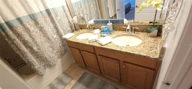 bathroom with tile patterned flooring and vanity