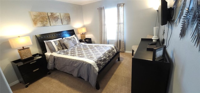 bedroom featuring light colored carpet