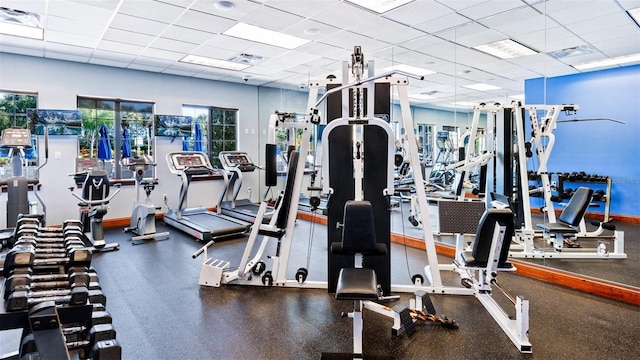 exercise room featuring a drop ceiling