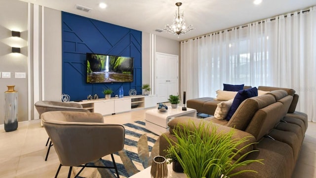 living room featuring an inviting chandelier and light tile patterned floors