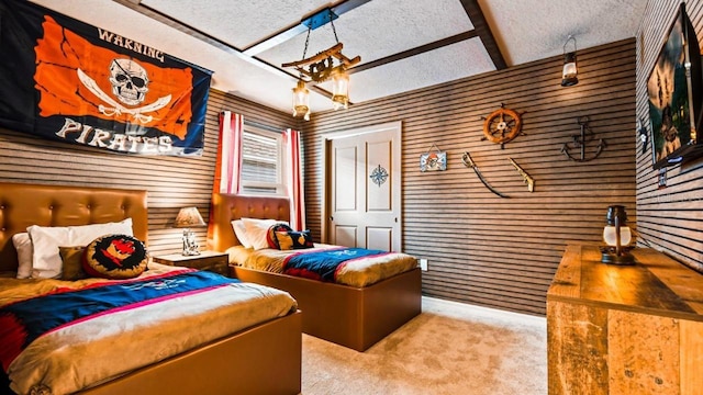 bedroom featuring light carpet, beam ceiling, a textured ceiling, and wood walls