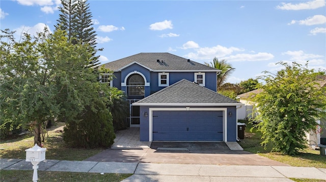 traditional home with stucco siding and roof with shingles