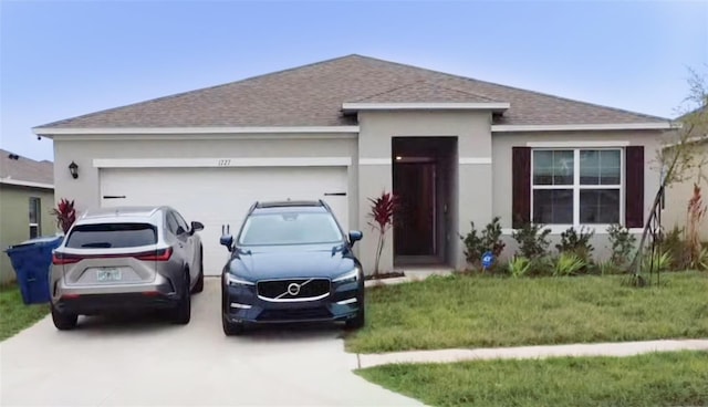 ranch-style house with a garage and a front yard