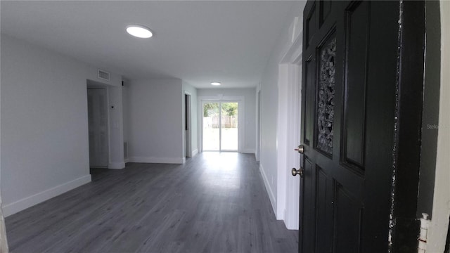 entrance foyer featuring wood finished floors, visible vents, and baseboards