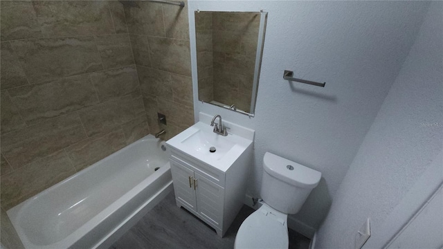 full bath featuring bathtub / shower combination, vanity, and toilet