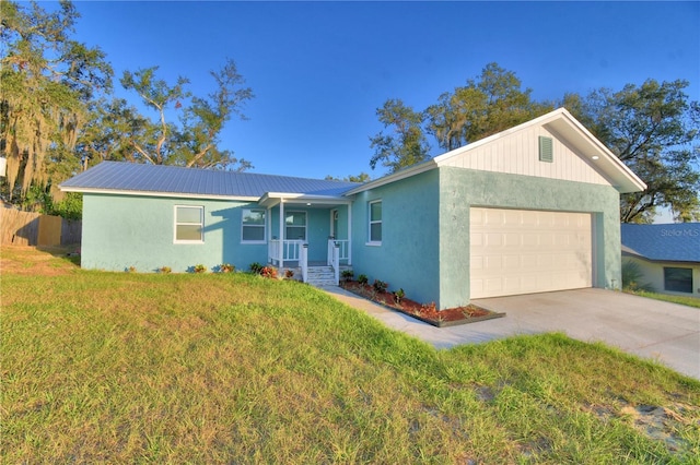 ranch-style home featuring a garage, a front yard, and a porch