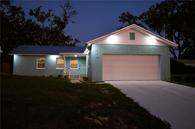 view of front of property with a garage