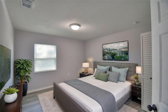 bedroom with light hardwood / wood-style flooring