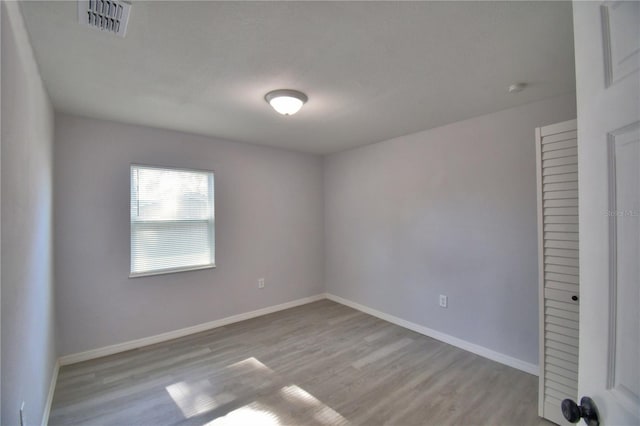 unfurnished room featuring light hardwood / wood-style flooring