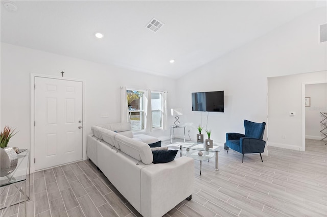 living room with lofted ceiling