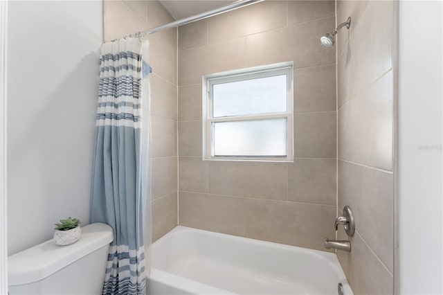 bathroom with shower / bathtub combination with curtain and toilet