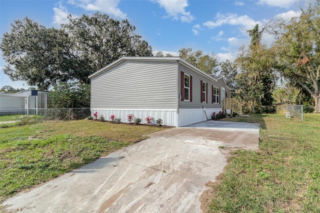 view of side of property featuring a yard